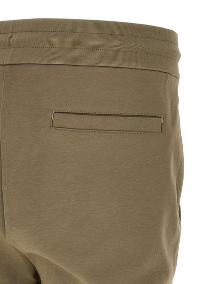Joggers by Hugo Boss for men in polyester cotton & leather bicolour & green features an sartorial straight-leg and long with a cut for a sartorial finish.
