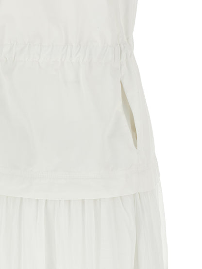Dress by PINKO for women in cotton white features an sultry silhouette defined by a v-neck neckline and , falling to an sultry long for a sultry look.