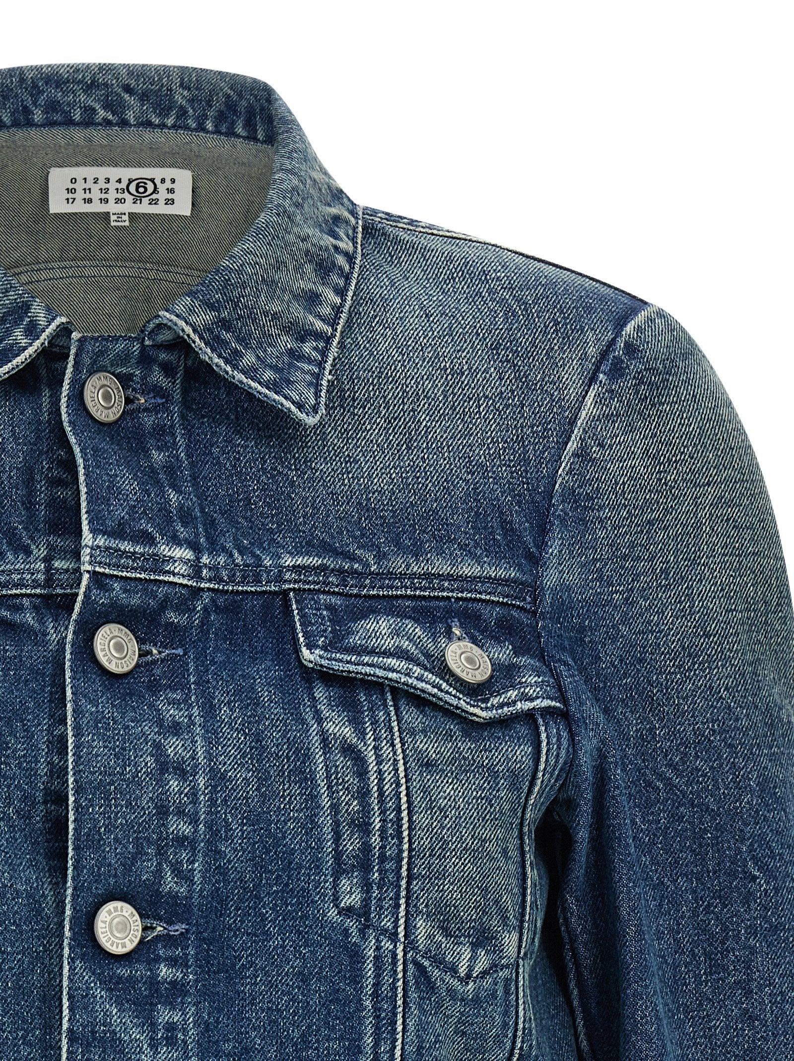 Trucker Jacket by MM6 Maison Margiela for women in denim cotton blue, white & signature features an on trend silhouette, showcasing refined pockets and a sophisticated shirt-collar neckline for a truly on trend finish.
