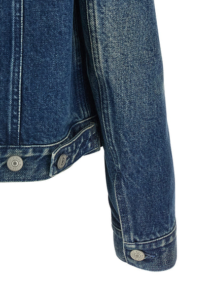 Trucker Jacket by MM6 Maison Margiela for women in denim cotton blue, white & signature features an contemporary silhouette, showcasing a sophisticated shirt-collar neckline and contemporary pockets for a truly refined look.