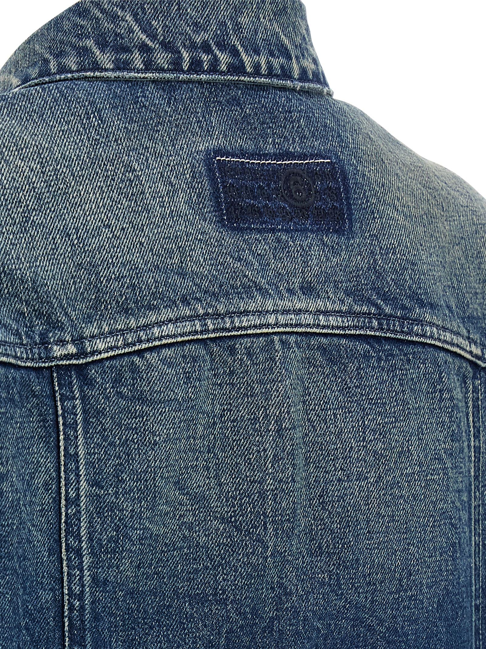 Trucker Jacket by MM6 Maison Margiela for women in denim cotton blue, white & signature presents a effortlessly chic silhouette, showcasing a sophisticated and premium pockets for a truly effortlessly chic finish.