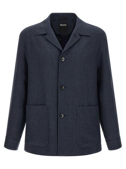 Overcoat by ZEGNA for men in linen wool & leather blue & signature features an voluminous silhouette, showcasing distinct pockets and a voluminous shirt-collar neckline for a truly voluminous aesthetic.