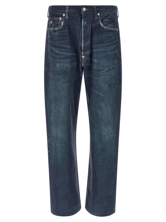 Jeans by Junya Watanabe for men in linen & denim cotton blue presents a tailored silhouette, showcasing a tailored straight-leg & wide and long cut with a refined high rise for a truly tailored aesthetic.