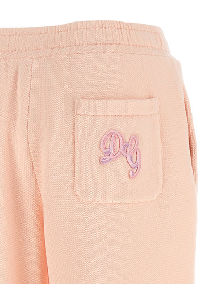 Joggers by Dolce & Gabbana for women in cotton multicolor & pink features an sartorial athletic & wide and long with a cut for a sartorial finish.