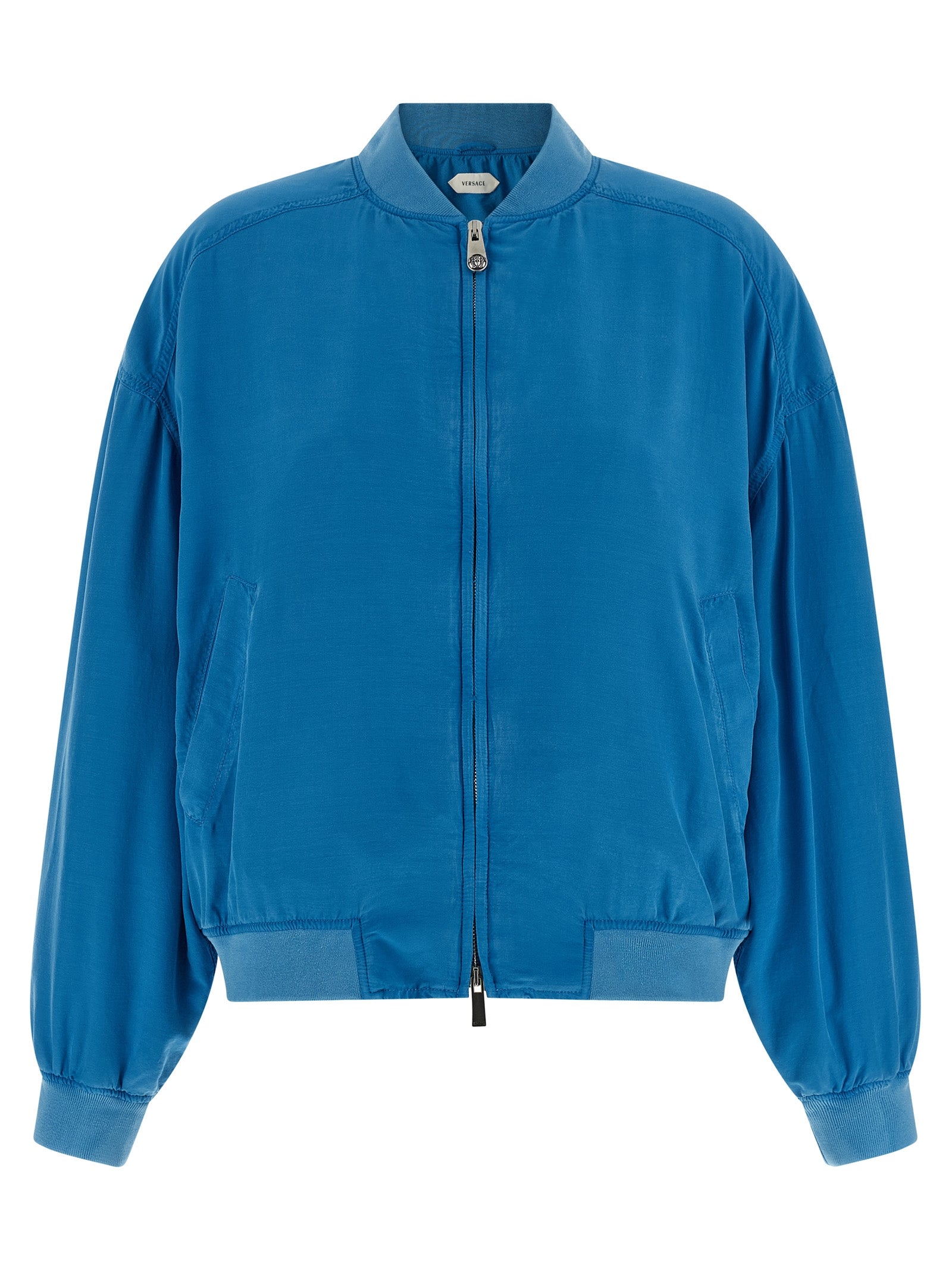Bomber Jacket by Versace for women in silk light-blue features a dramatic silhouette, showcasing a sophisticated high-neck neckline and distinctive pockets for a dramatic aesthetic.