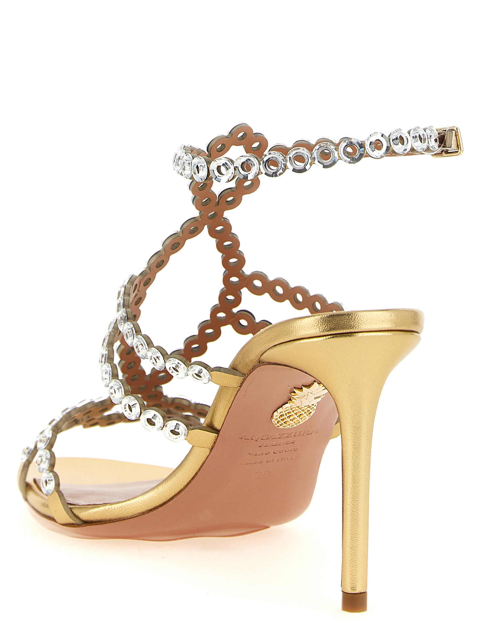 Stiletto Ankle Strap Sandals by Aquazzura for women in lamb leather gold & patterned showcases a sculptural silhouette as Women's Lamb Leather Stiletto Ankle Strap Sandals, defined by a sculptural stiletto and sculptural for a sculptural look.