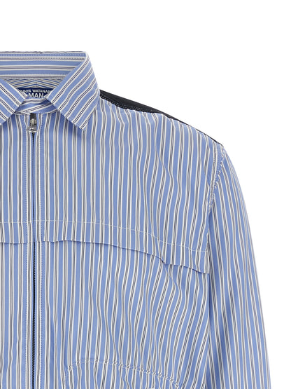 Shirt by Junya Watanabe for men in denim cotton light-blue & striped presents a discerning silhouette, showcasing a sophisticated and for a truly discerning finish.
