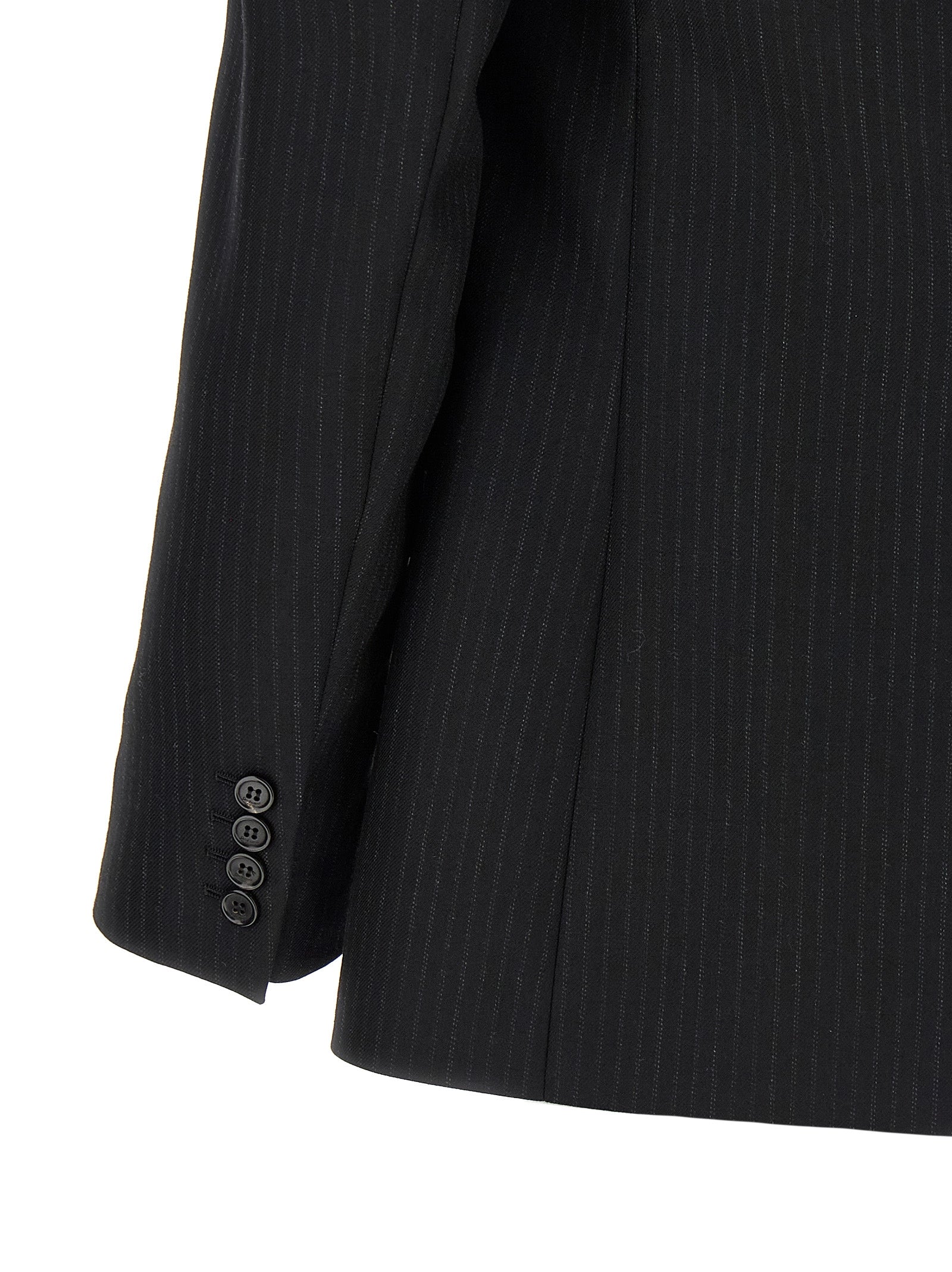 This Blazer by Saint Laurent for men in wool & silk black & pinstripe presents a tailored silhouette, meticulously tailored with a tailored and distinctive for a tailored finish.