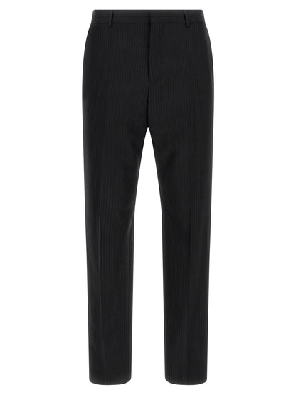Trousers by Saint Laurent for men in wool black presents a smart silhouette, meticulously detailed with a smart , a smart long, and a smart mid rise.