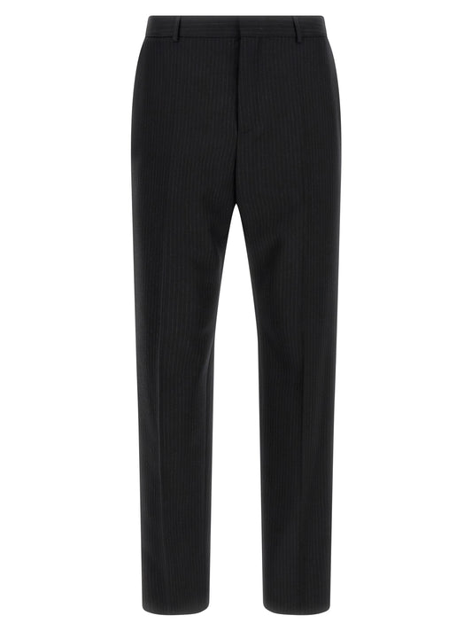 Trousers by Saint Laurent for men in wool black presents a smart silhouette, meticulously detailed with a smart , a smart long, and a smart mid rise.