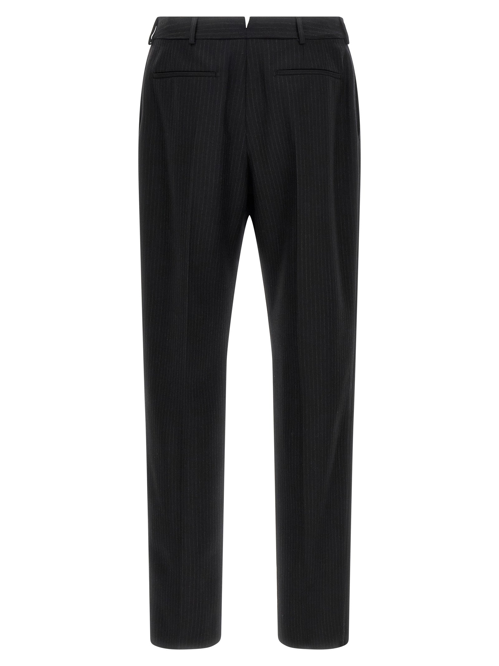 Trousers by Saint Laurent for men in wool black presents a perennial silhouette, meticulously tailored with a cut, long finish, and an elegant mid rise.