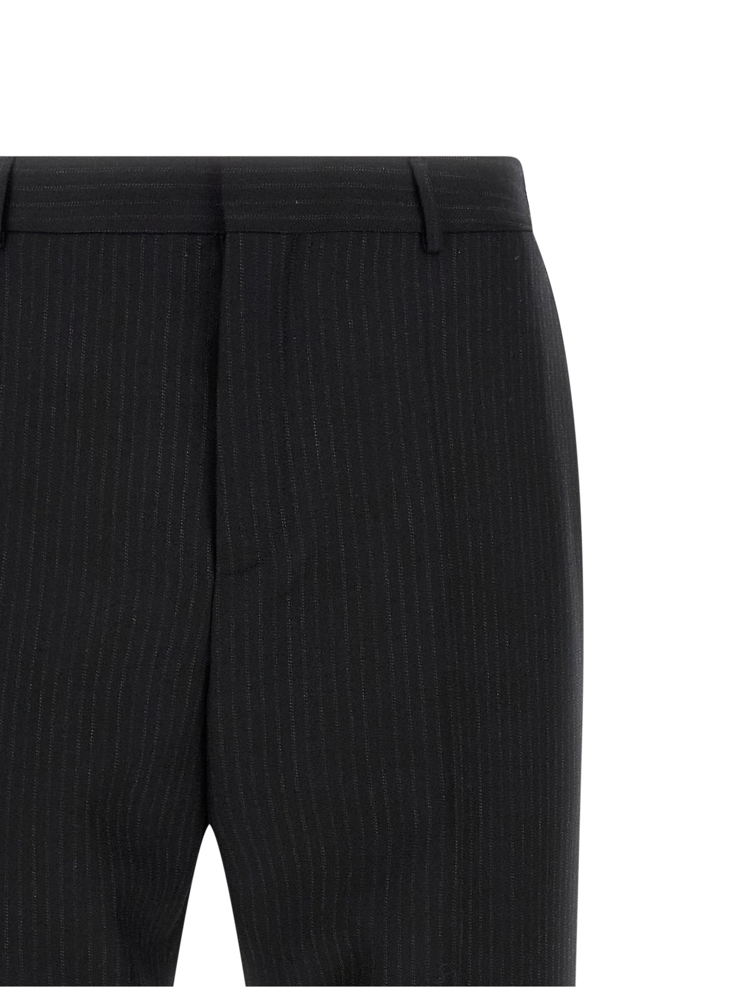 Trousers by Saint Laurent for men in wool black features a sculptural silhouette, showcasing a sculptural and long with a sophisticated mid rise for a sculptural finish.
