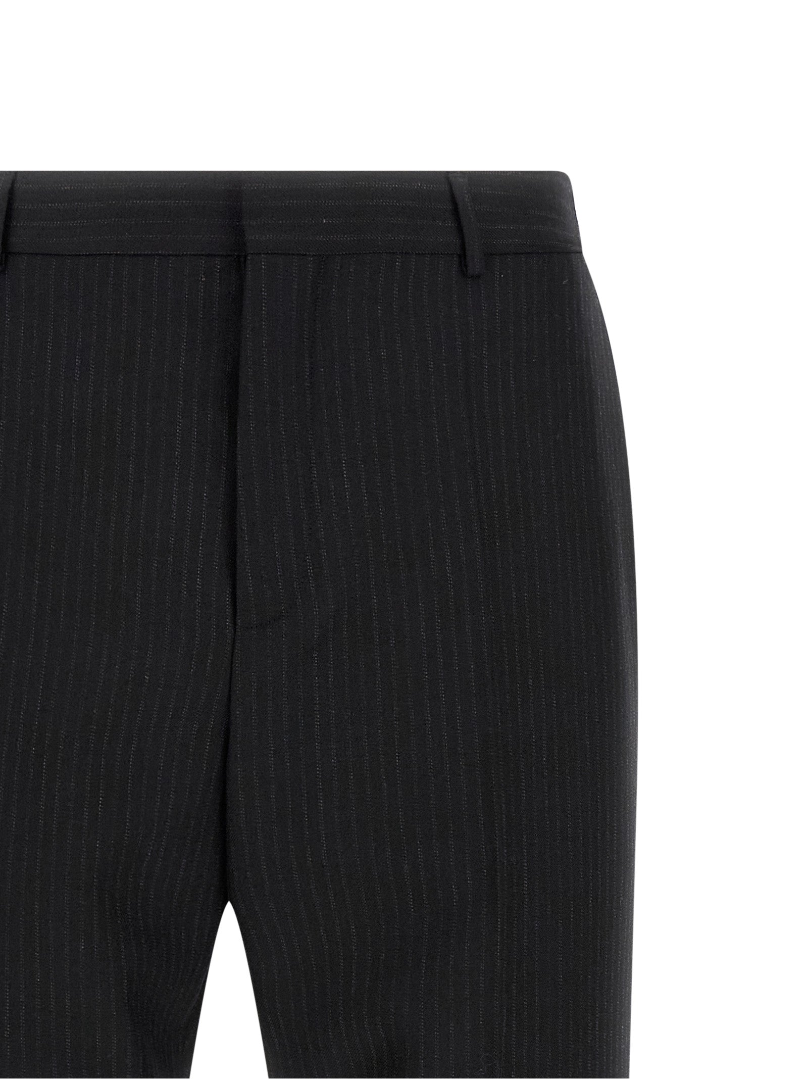 Trousers by Saint Laurent for men in wool black features a sculptural silhouette, showcasing a sculptural and long with a sophisticated mid rise for a sculptural finish.
