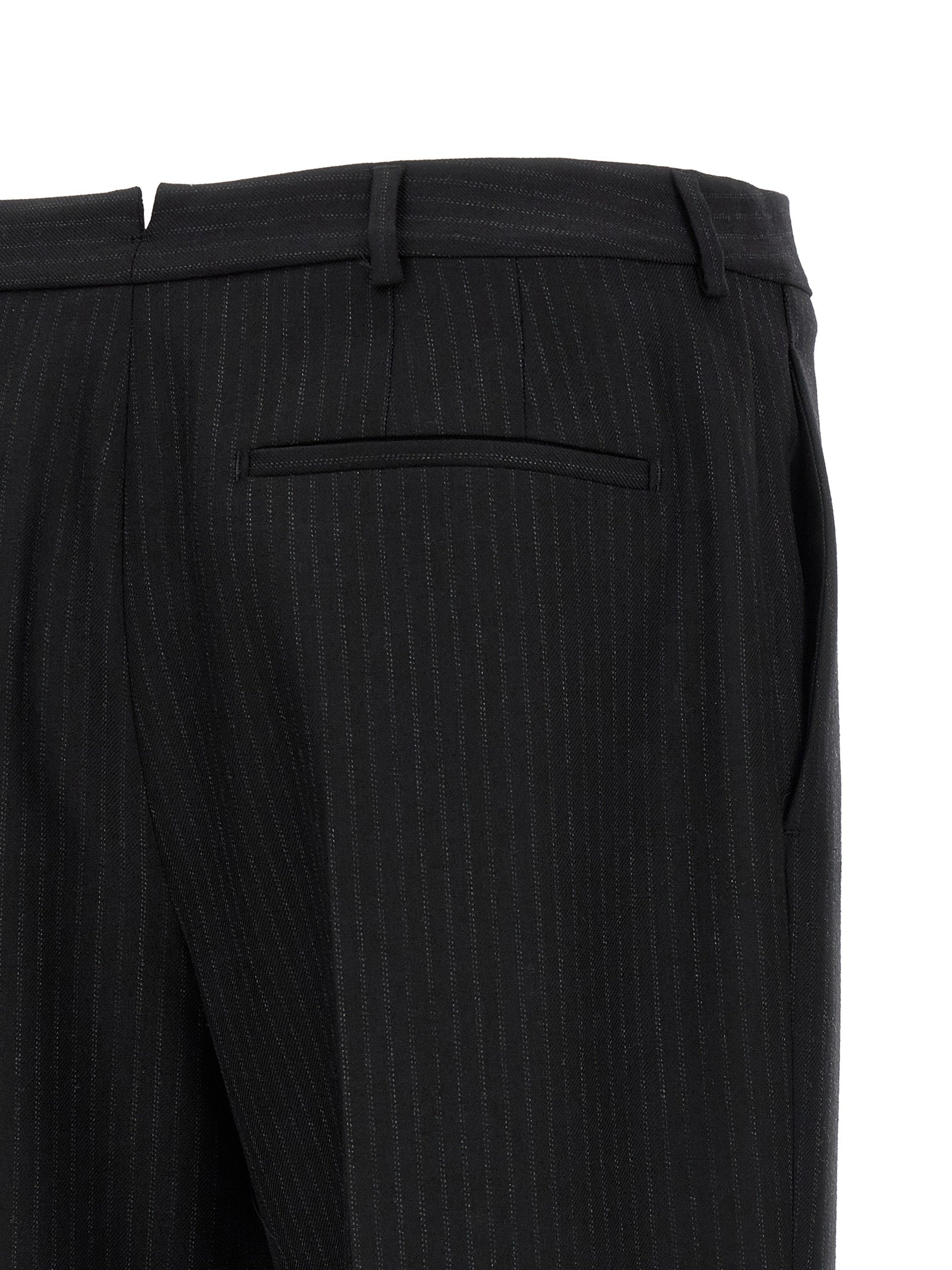 Trousers by Saint Laurent for men in wool black presents a smart silhouette, meticulously detailed with a smart , a smart long, and a smart mid rise.