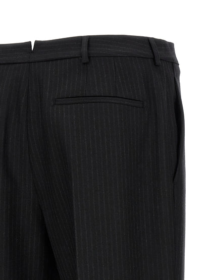 Trousers by Saint Laurent for men in wool black presents a smart silhouette, meticulously detailed with a smart , a smart long, and a smart mid rise.