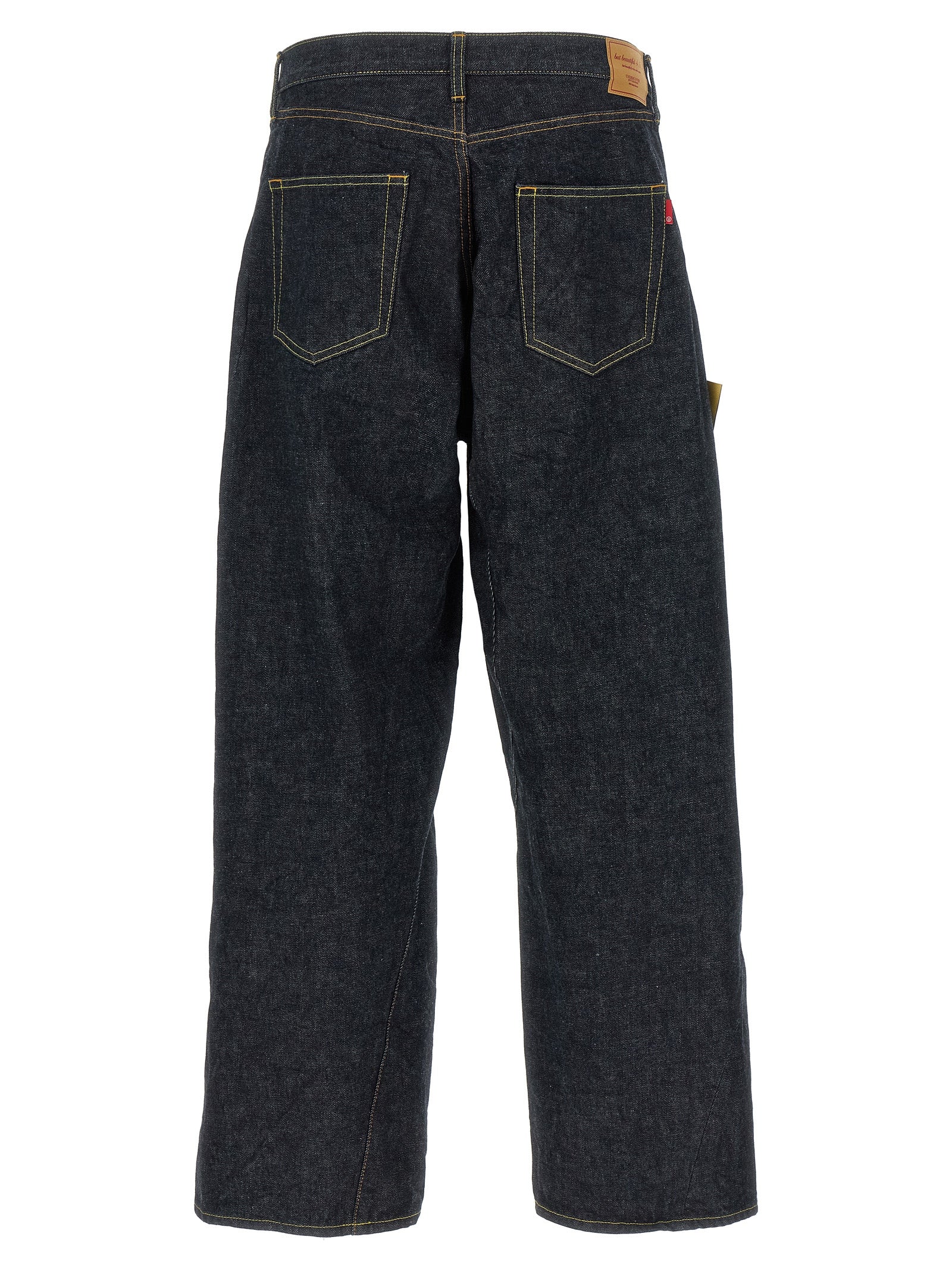 Jeans by Undercover for men in cotton denim blue features an sartorial wide and long with a cut for a sartorial finish.