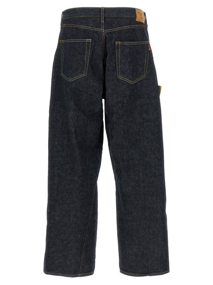 Jeans by Undercover for men in cotton denim blue features an sartorial wide and long with a cut for a sartorial finish.