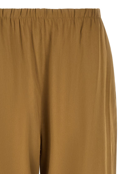 Trousers by Max Mara for women in linen & viscose beige presents a smart silhouette, meticulously detailed with a smart straight-leg & wide, a smart long, and a smart .