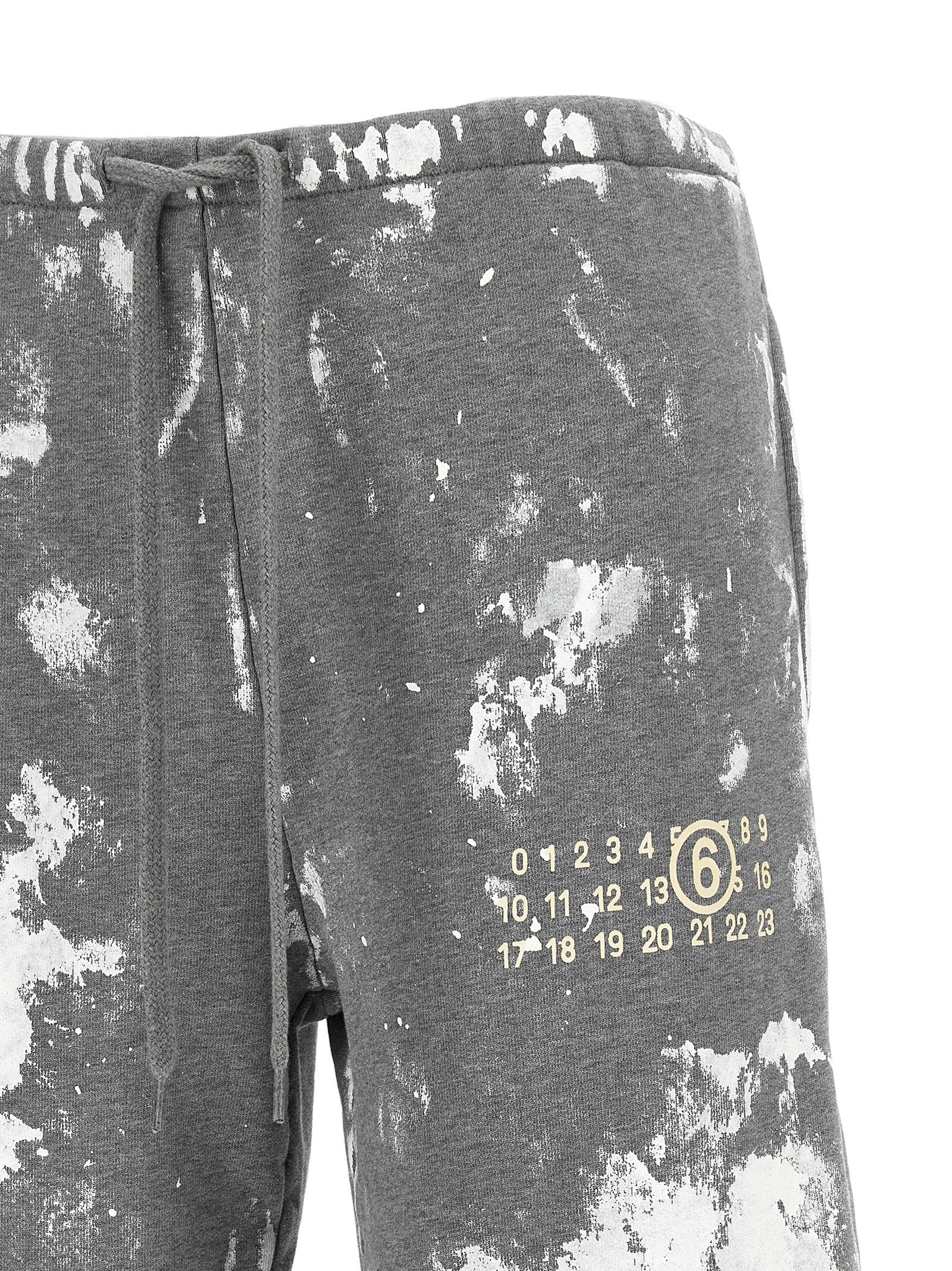 Joggers by MM6 Maison Margiela for women in cotton gray, white, signature & print presents a refined pantology silhouette, artfully defined by a refined pantology straight-leg & wide, long, and a sophisticated .