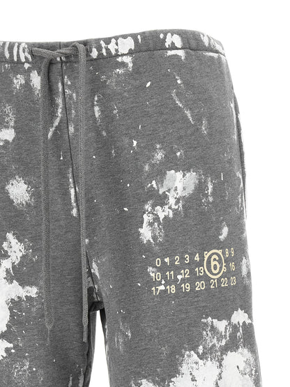 Joggers by MM6 Maison Margiela for women in cotton gray, white, signature & print presents a refined pantology silhouette, artfully defined by a refined pantology straight-leg & wide, long, and a sophisticated .