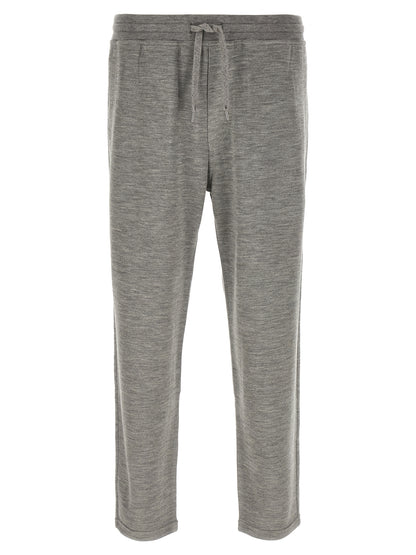 Joggers by Brunello Cucinelli for men in polyamide & cashmere gray presents a tailored silhouette, showcasing a tailored straight-leg and long cut with a refined for a truly tailored aesthetic.