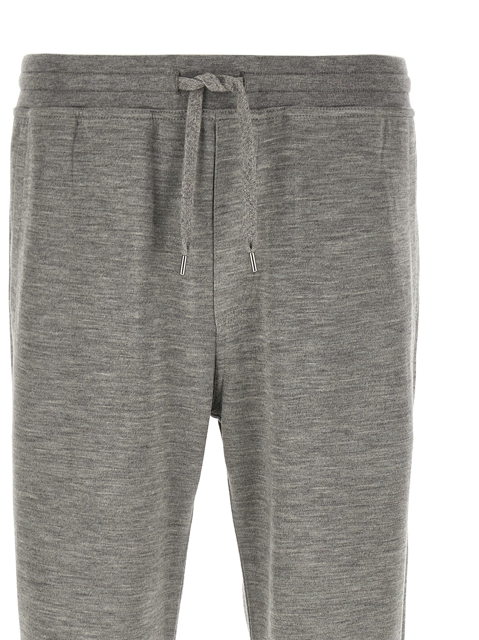 Joggers by Brunello Cucinelli for men in polyamide & cashmere gray features an sophisticated and straight-leg with a precise long, creating a sophisticated and sophisticated silhouette.