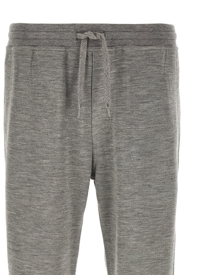 Joggers by Brunello Cucinelli for men in polyamide & cashmere gray features an sophisticated and straight-leg with a precise long, creating a sophisticated and sophisticated silhouette.