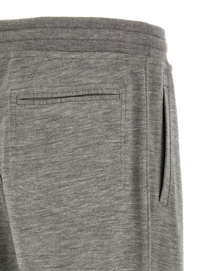 Joggers by Brunello Cucinelli for men in polyamide & cashmere gray features a polished silhouette with a polished straight-leg, reaching a polished long and finished with a polished .