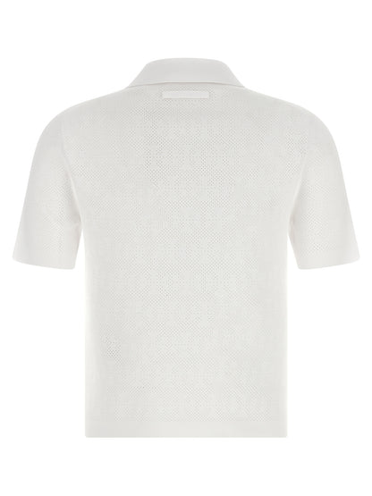This Polo Shirt by Tory Burch for women in viscose polyester & polyamide white presents a flawless silhouette, showcasing flawless detailing and a refined for a truly flawless aesthetic.