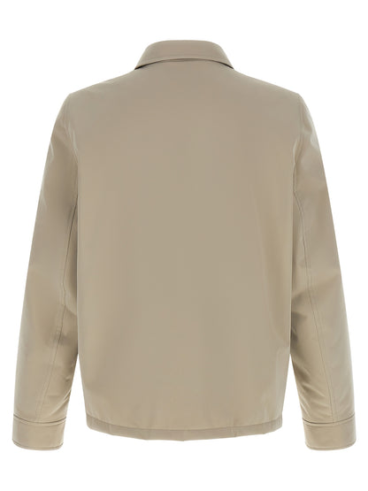 Overcoat by Brunello Cucinelli for men in polyester & nylon gray showcases a architectural silhouette, artfully detailed with a distinctive and functional windproof & pockets for a architectural finish.