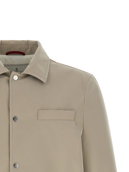 Overcoat by Brunello Cucinelli for men in polyester & nylon gray presents a luxurious silhouette, showcasing a luxurious and sophisticated windproof & pockets for a premium, luxurious look.