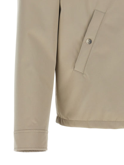 Overcoat by Brunello Cucinelli for men in polyester & nylon gray features a contemporary silhouette showcasing a contemporary and refined windproof & pockets for a sophisticated finish.