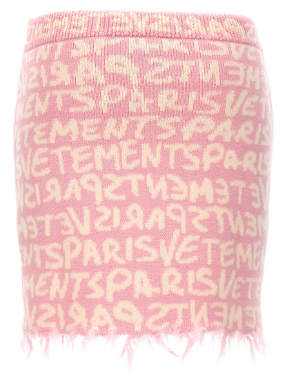 Skirt by Vetements for women in merino wool multicolor, pink, patterned, jacquard & monogram features an tailored silhouette, artfully capturing the essence of Women's Merino Wool Maxi Long Skirt in a sophisticated maxi long.