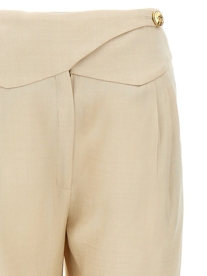 Trousers by Blazé Milano for women in viscose beige features an sartorial silhouette, showcasing a precise straight-leg and long with a sartorial high rise for a refined look.