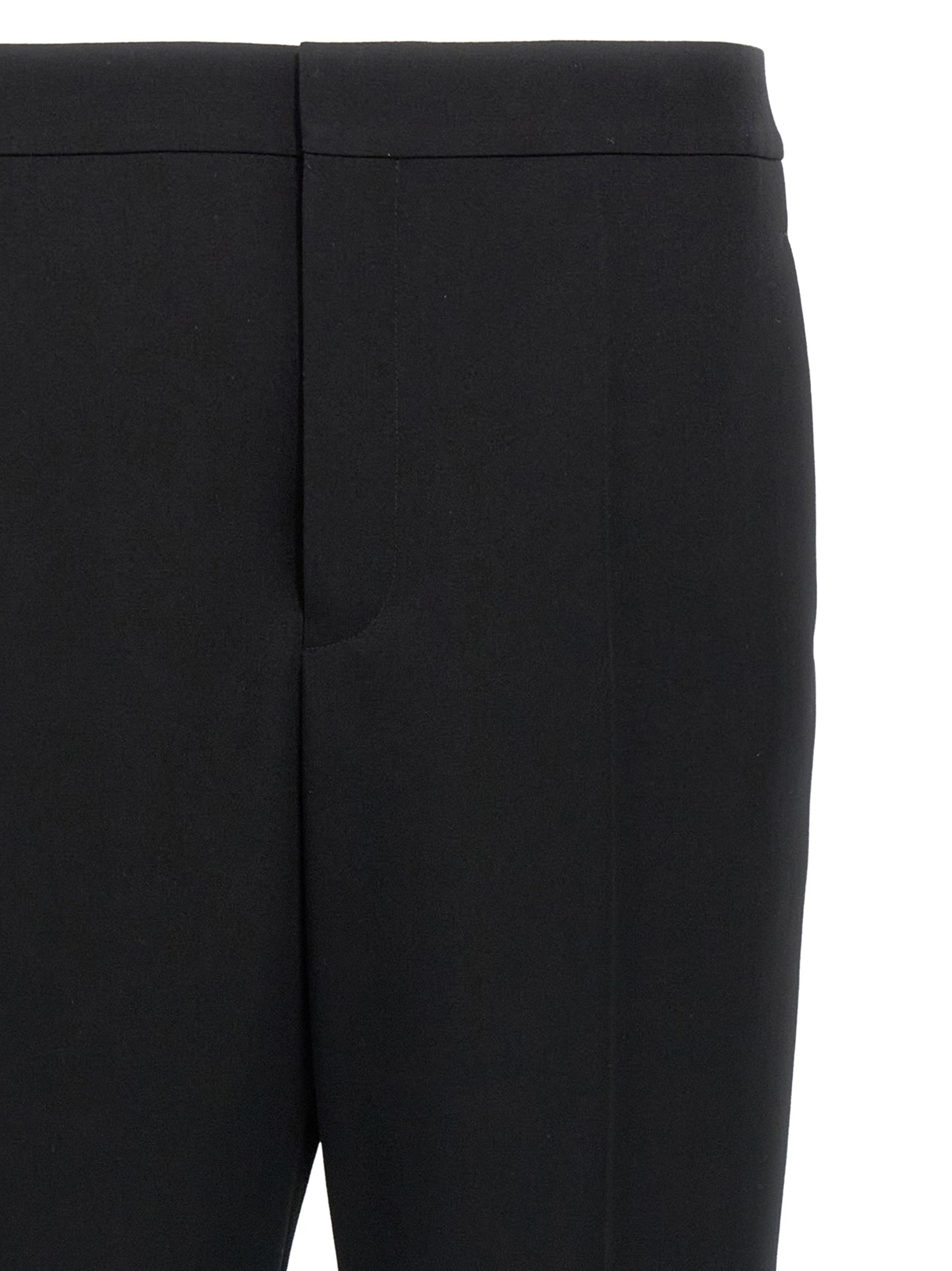 Trousers by Saint Laurent for men in wool black features a sculptural silhouette, showcasing a sculptural and long with a sophisticated for a sculptural finish.