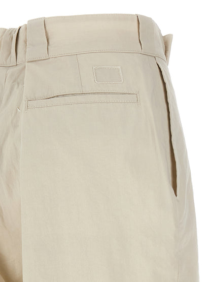 Casual Pants by Maison Margiela for women in polyamide cotton beige features a polished silhouette with a polished wide, reaching a polished long and finished with a polished .