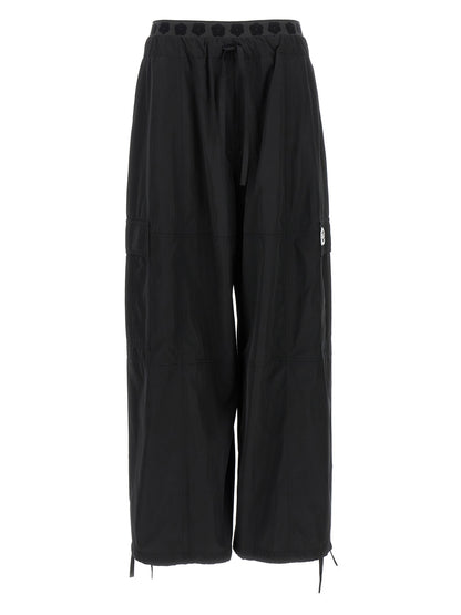 Cargo Pants by Kenzo for women in cotton polyester black features an urban chic with a and long, creating a urban chic aesthetic for "Moon Behind the Hill".