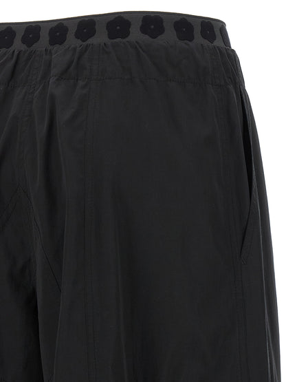 Cargo Pants by Kenzo for women in cotton polyester black presents a on trend silhouette, artfully finished with a on trend , long, and for a sophisticated look.
