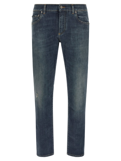 Jeans by Dolce & Gabbana for men in stretch denim cotton blue features an sophisticated low rise and straight-leg with a precise long, creating a sophisticated and sophisticated silhouette.