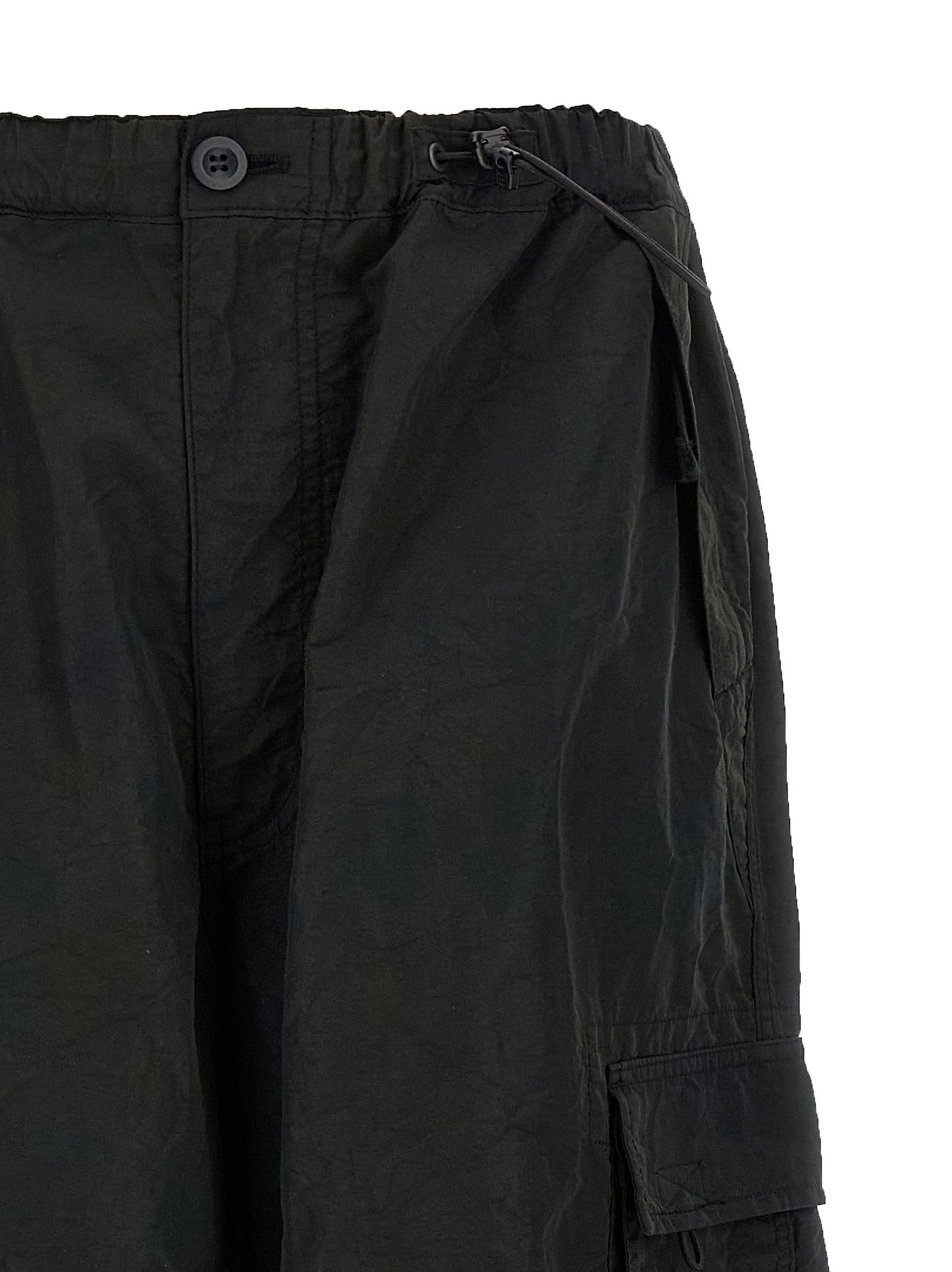 Cargo Pants by Comme Des Garçons for men in nylon fabric black features a architectural straight-leg & wide with a architectural long and architectural .