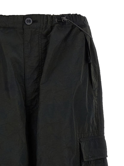 Cargo Pants by Comme Des Garçons for men in nylon fabric black features a architectural straight-leg & wide with a architectural long and architectural .