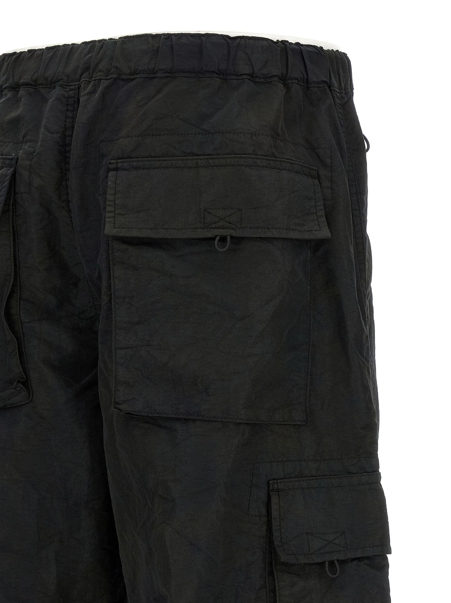 Cargo Pants by Comme Des Garçons for men in nylon fabric black presents a on trend silhouette, artfully finished with a on trend straight-leg & wide, long, and for a sophisticated look.