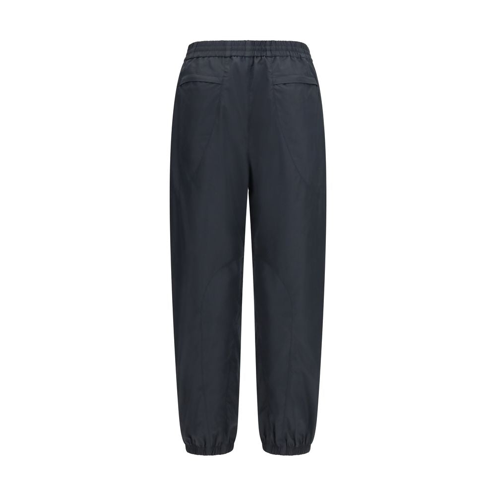 Joggers by Givenchy for men in cotton polyester black & signature features a polished silhouette with a polished relaxed-fit & regular-fit, reaching a polished long and finished with a polished .