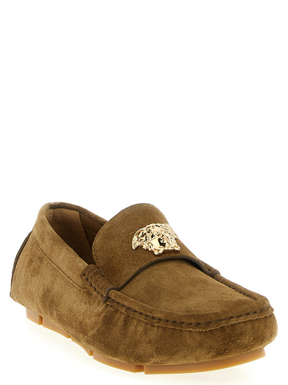 This Loafer Slip-On Shoes by Versace for men in suede calfskin leather brown & signature features an exquisite silhouette from the Medusa Men's Suede Calfskin Leather Loafer Slip-On Shoes collection, defined by a sophisticated and elegant .