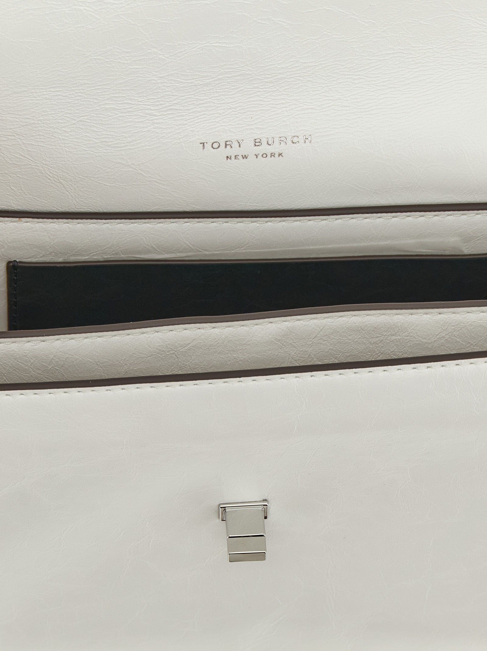 Shoulder Flap Bag by Tory Burch for women in lamb leather white features an effortlessly chic silhouette with a secure snap & flap, ample , and versatile shoulder-strap for effortlessly chic everyday luxury.