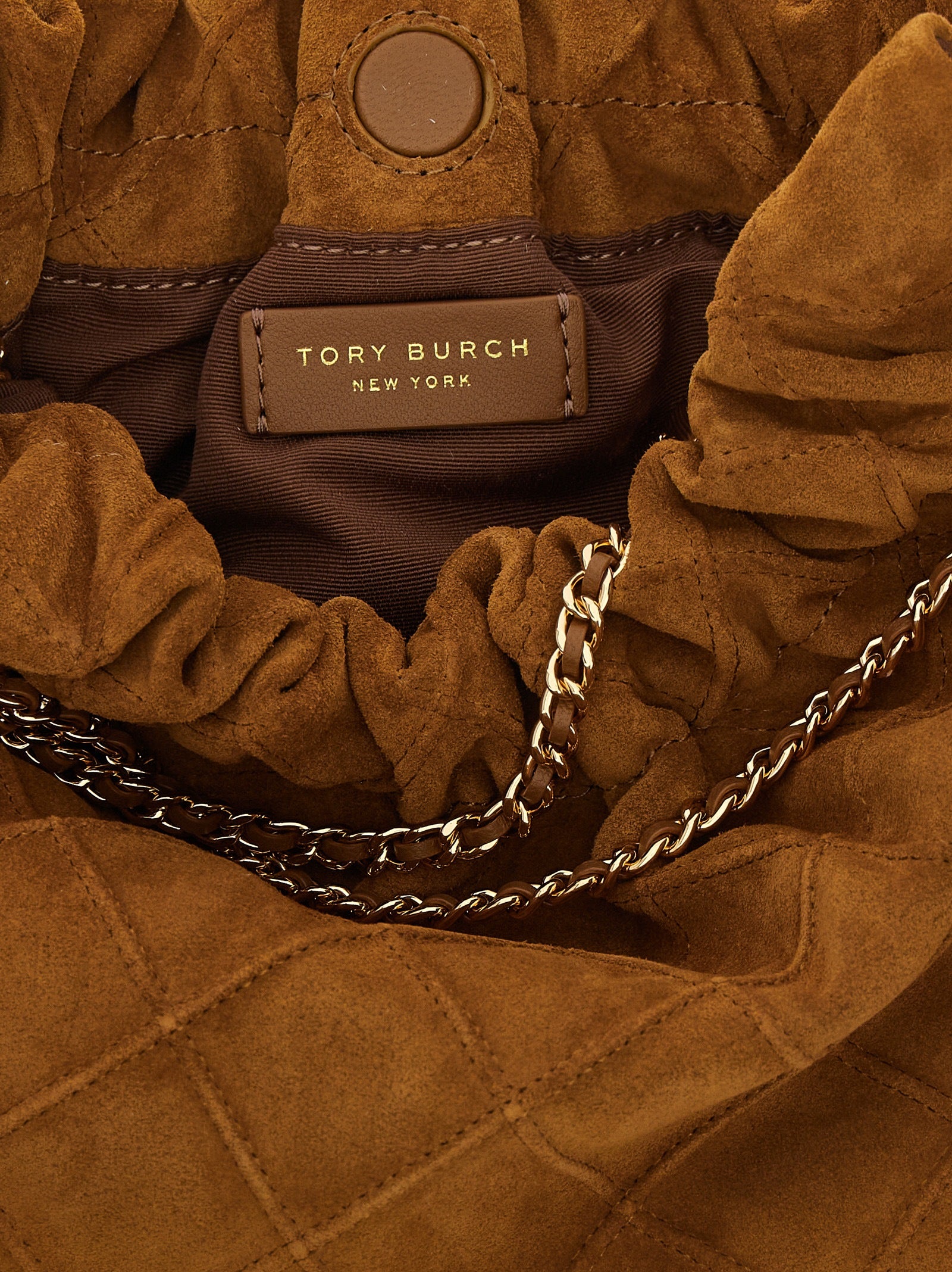 Mini Handbag by Tory Burch for women in leather & metal brown & patterned features a ornamental silhouette, showcasing a secure magnetic, ample , and ornamental shoulder-strap & handle for a sophisticated look.