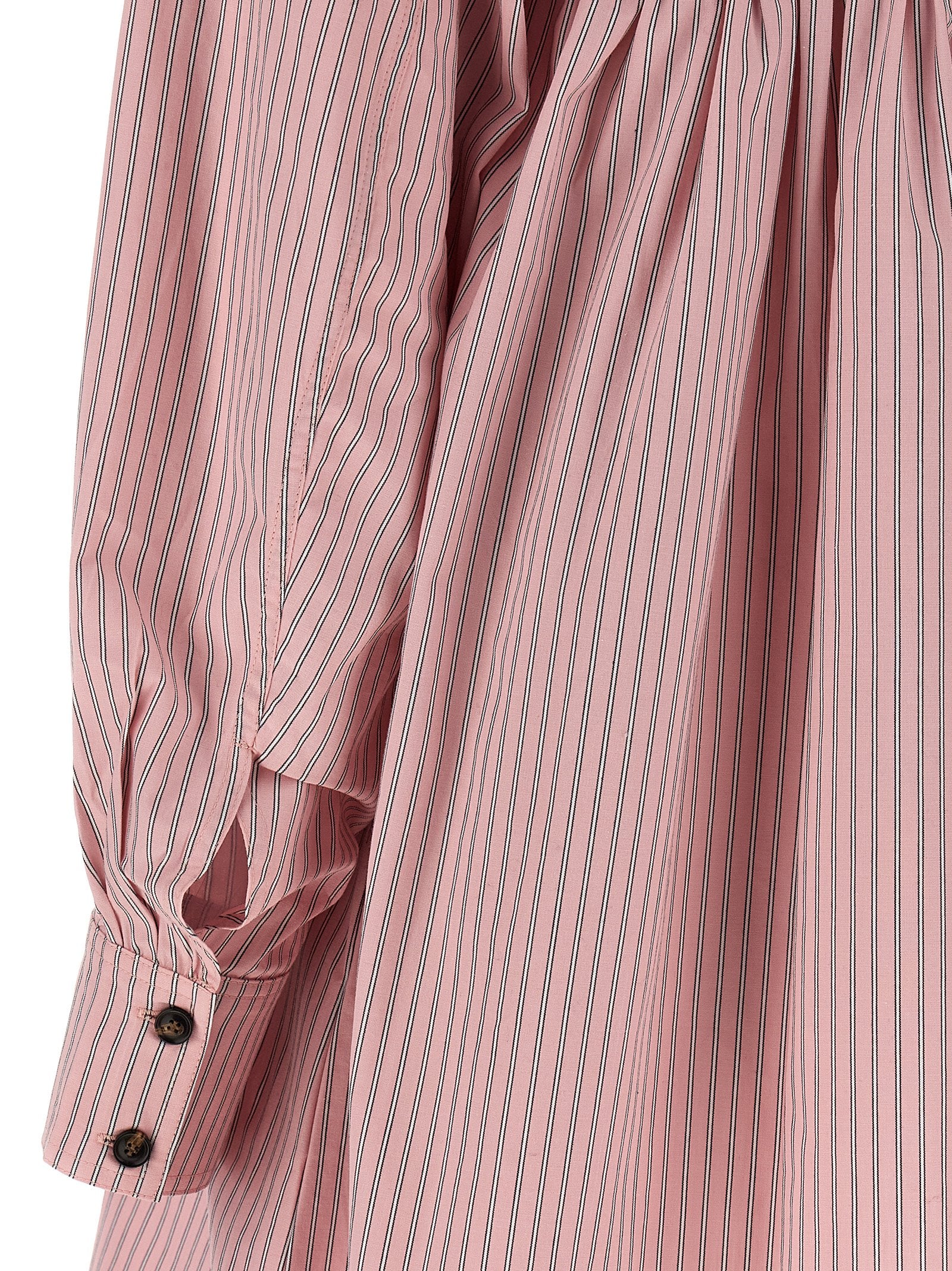 Dress by Ganni for women in organic cotton multicolor, pink & striped features an magnificent silhouette, artfully detailed with a magnificent and that flows into an magnificent short mini.
