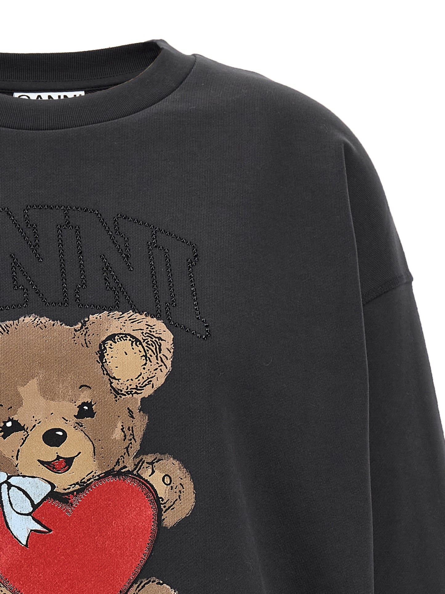 Sweatshirt by Ganni for women in organic cotton & rhinestone black & print features an exquisite silhouette, showcasing and details for a exquisite look.