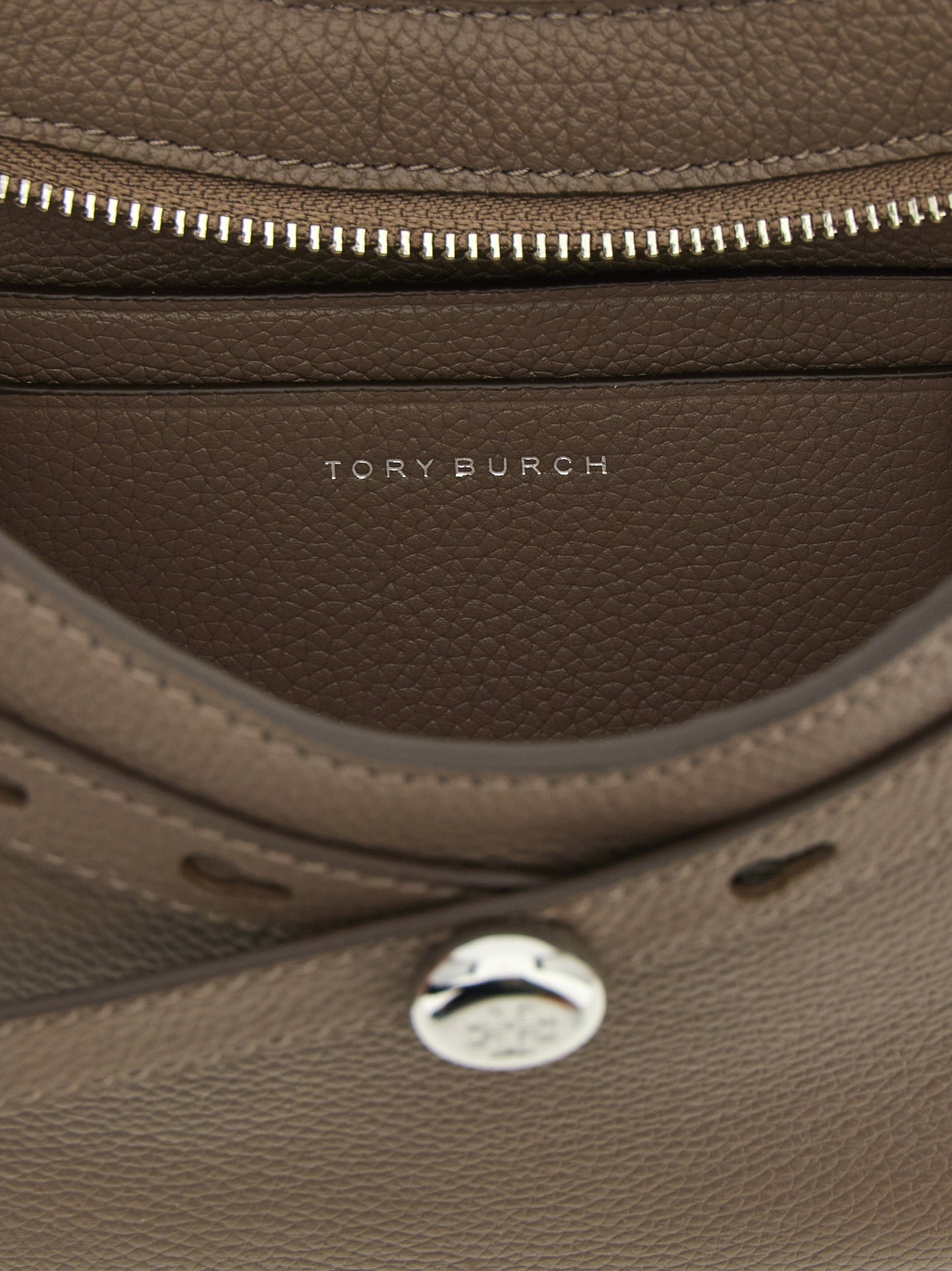 Shoulder Bag by Tory Burch for women in suede leather brown features a effortless chic silhouette with a secure zipper, ample , and versatile shoulder-strap & adjustable-strap for a effortless chic finish.