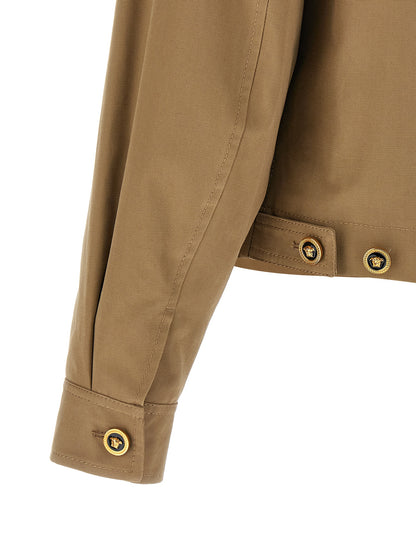 Jacket by Versace for men in cotton beige showcases a contemporary silhouette, detailed with a contemporary and premium pockets for a sophisticated finish.